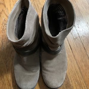 Beige suede ankle boots with brown strap buckle